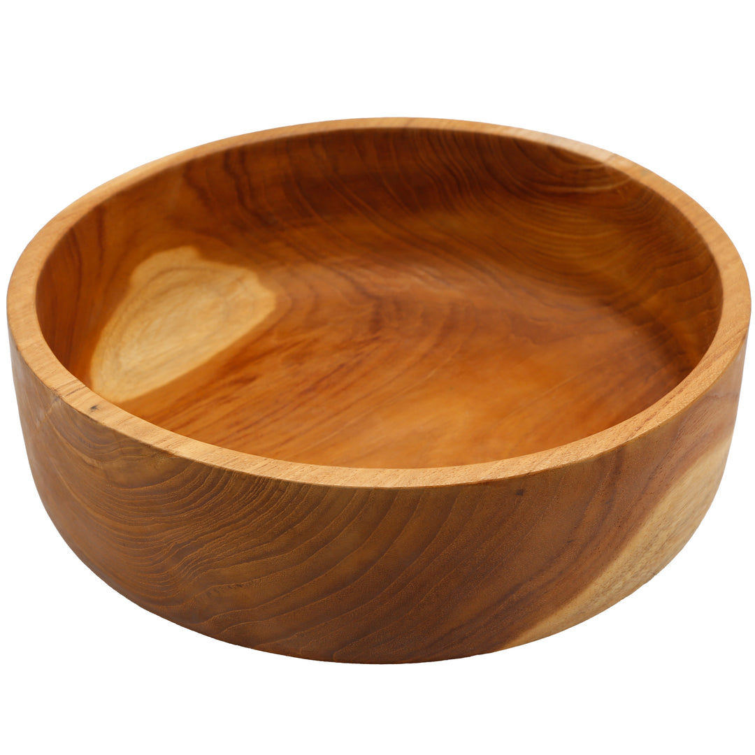 Runde Teak-Holzschale, von oben fotografiert, mit sanftem Farbverlauf