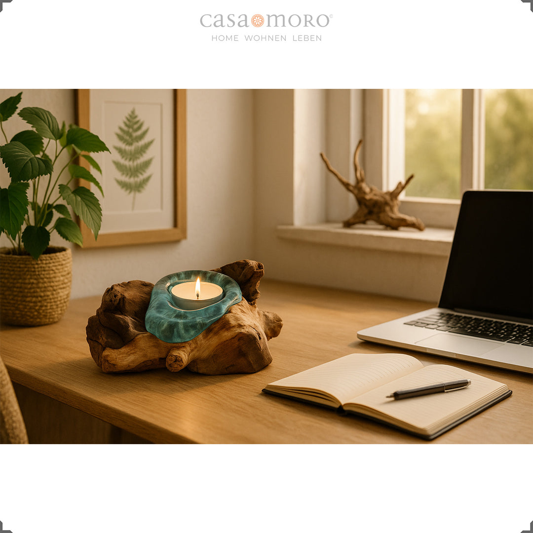 Tealight holder made of glass and burl wood on a desk, its soft light creates a natural, relaxed working atmosphere.