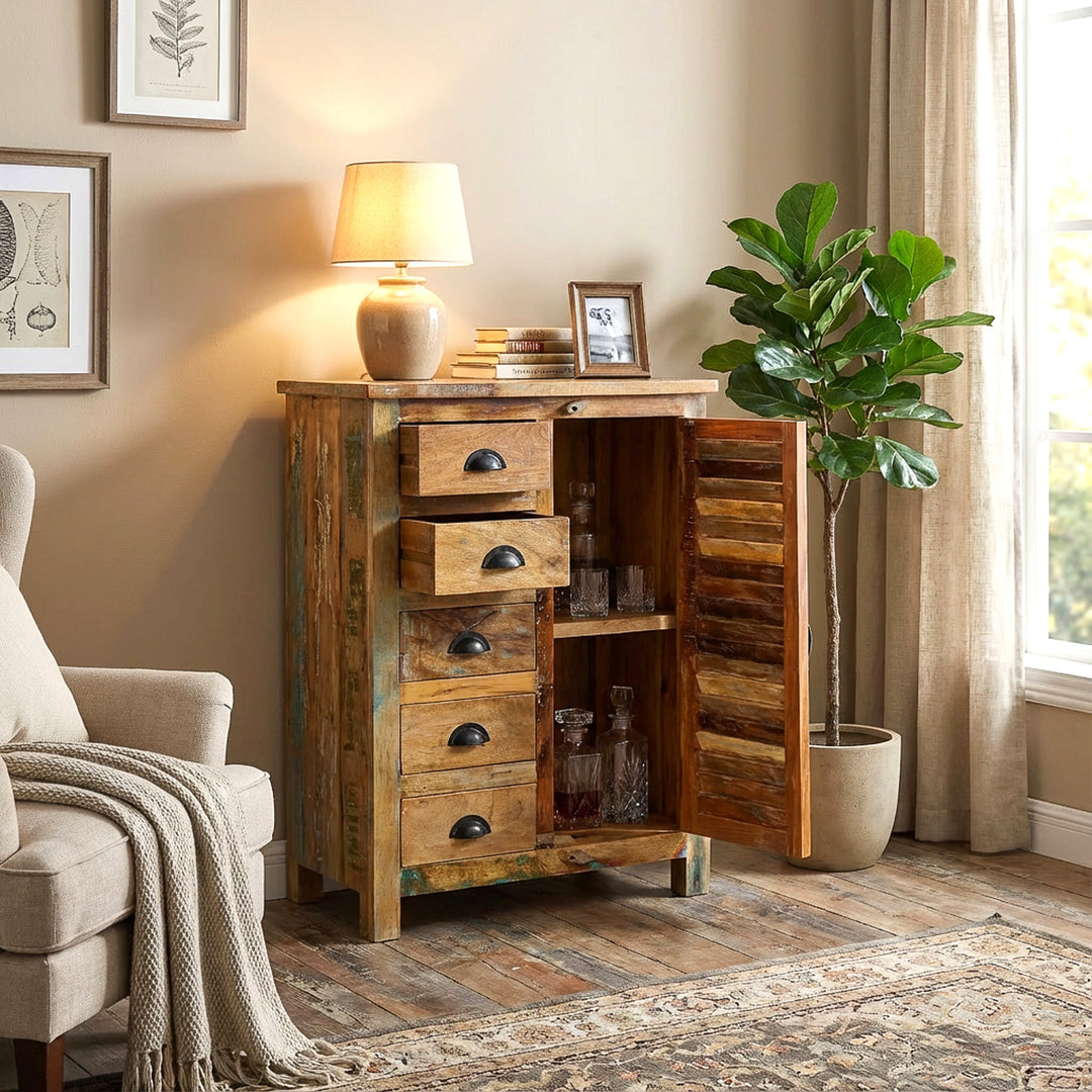Solid wood highboard in the living room, open door and drawers, warm country house atmosphere