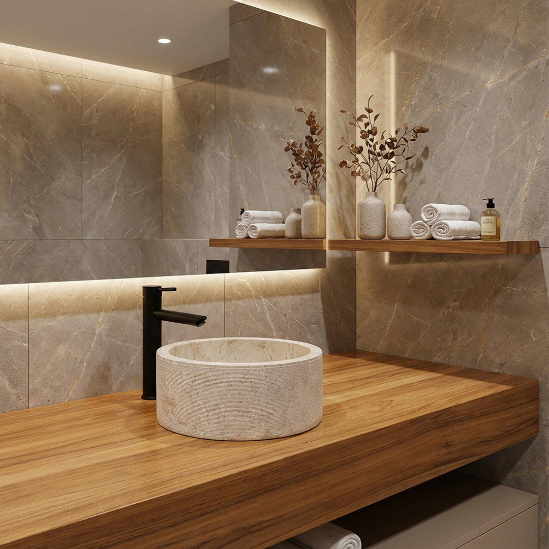 Round Washbasin made of natural stone on an elegant wooden console, modernly staged in the quiet bathroom with warm light.