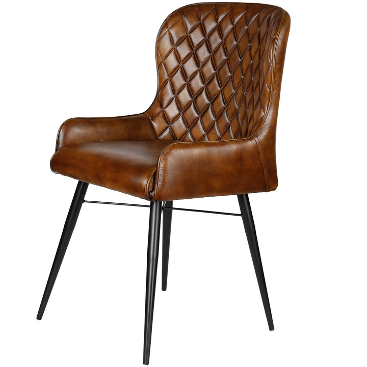 Isolated upholstered chair made of leather, antique brown, with metal frame