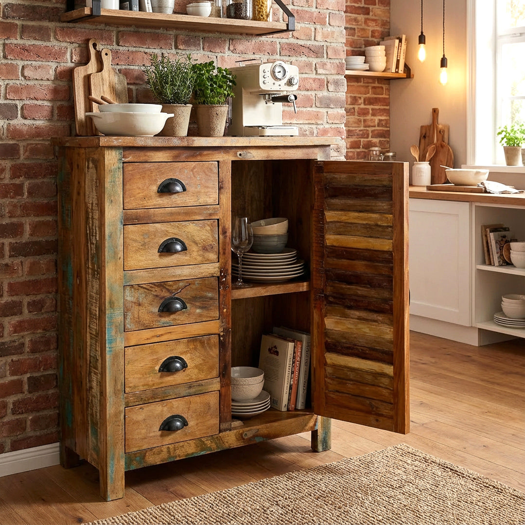 Solid wood highboard in the kitchen, opened door, dishes in the interior, warm vintage home scene