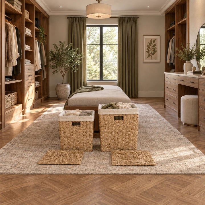 Set of 2 square seagrass laundry baskets, approx. 55 and 85 liters, with linens and discarded lids in the dressing room.